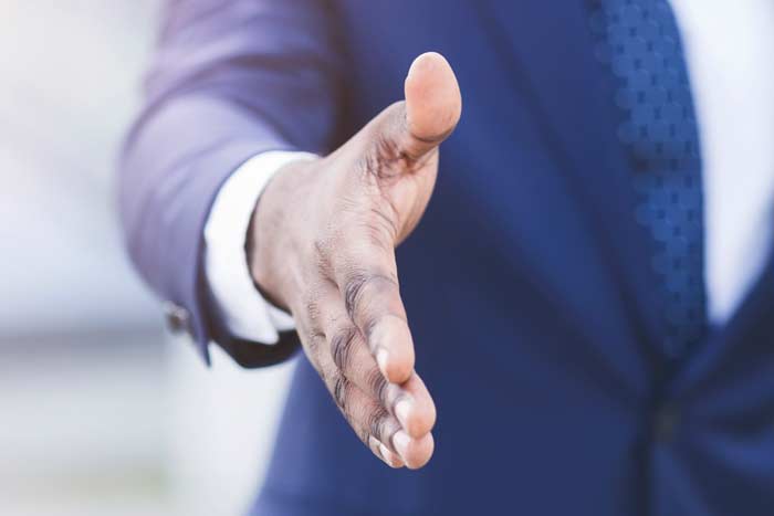 Unrecognizable Businessman Stretching Hand For Handshake Outdoor